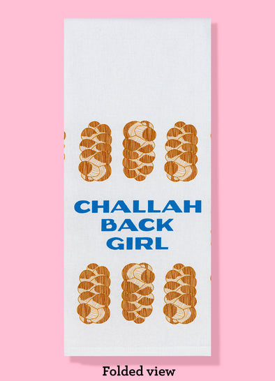 The "Challah Back Girl" dishtowel, shown folded into thirds. It features the text as well as an illustration of various loaves of challah bread around the text.