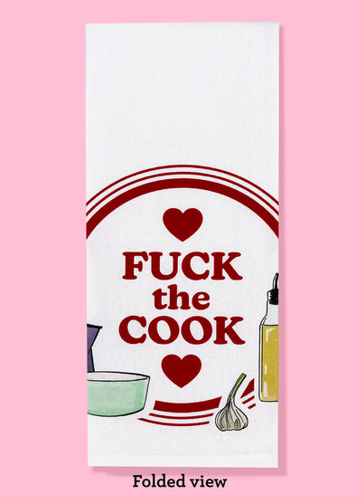 Folded dishtowel with the text FUCK THE COOK featuring 1970s style illustrations of food and kitchen tools.