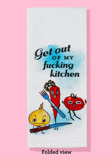 Folded dishtowel with the text GET OUT OF MY FUCKING KITCHEN and an illustration of anthropomorphic vegetables on the offensive.