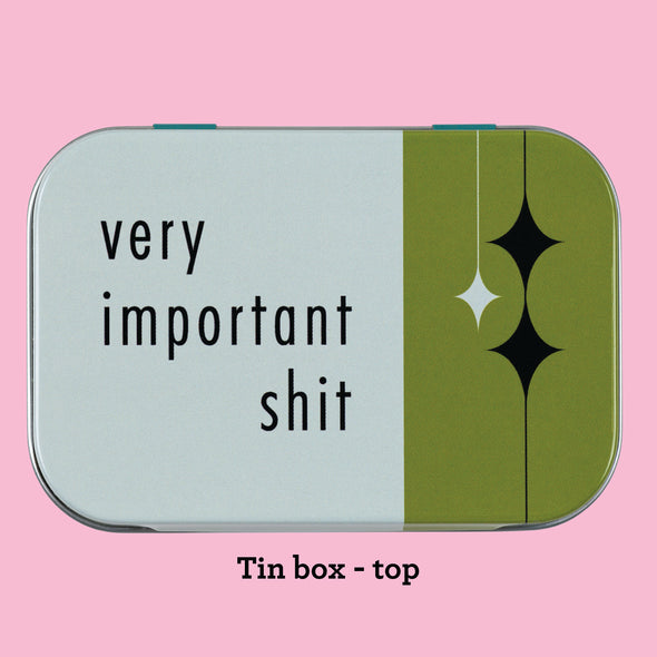 The top of the Very Important Shit tin, showing design elements on a white background with black text that reads "Very Important Shit"