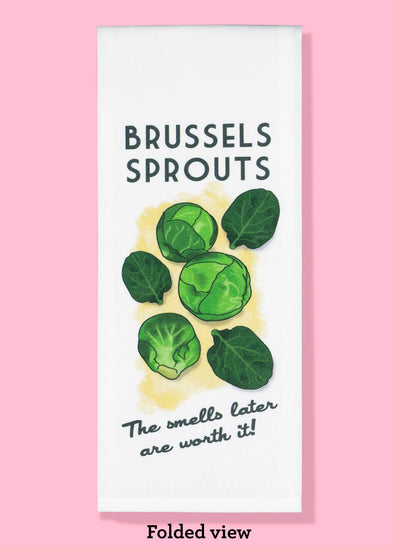 Folded dishtowel with the phrase Brussels Sprouts, The Smells Later are Worth It with an illustration of cooked Brussels Sprouts.