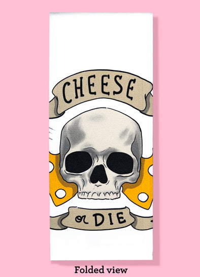 Folded dishtowel with an illustration of a skull and Swiss cheese and the phrase Cheese or Die.