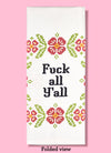 Folded dishtowel with an illustration of cross stitch flowers and the phrase Fuck All Yall.
