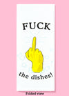 Folded dishtowel with an illustration of a yellow rubber kitchen glove with the middle finger extended and the phrase Fuck The Dishes.