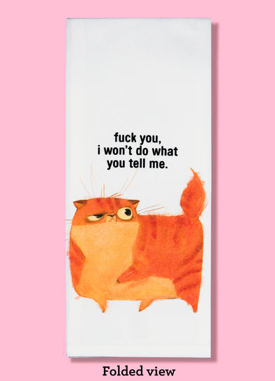 Folded dishtowel with an illustration of a funny orange cat and the phrase Fuck You I Won't Do What You Tell Me.