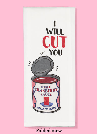 Folded dishtowel with an illustration of a can of cranberry sauce with a jagged open lid and the phrase I Will Cut You.