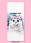 Folded dishtowel with an illustration of a funny cat with a tiara of pink flowers and the phrase I'm Tripping Balls.
