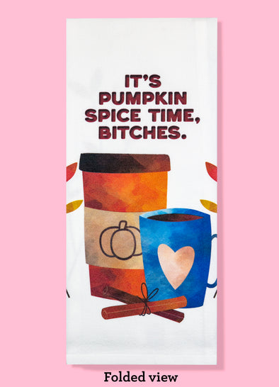 Folded dishtowel with an illustration of two cups of coffee, cinnamon sticks, and fall leaves with the phrase It's Pumpkin Spice Time, Bitches.