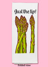 Folded dishtowel with an illustration of asparagus stalks and the phrase Just the Tip.