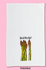 Unfolded dishtowel with an illustration of asparagus stalks and the phrase Just the Tip.