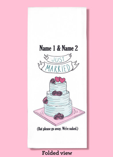 Folded dishtowel demonstrating how this product can be personalized. It features text that says Name 1 & Name 2 and an illustration of a wedding cake with the phrase Just Married But Please Go Away We're Naked.