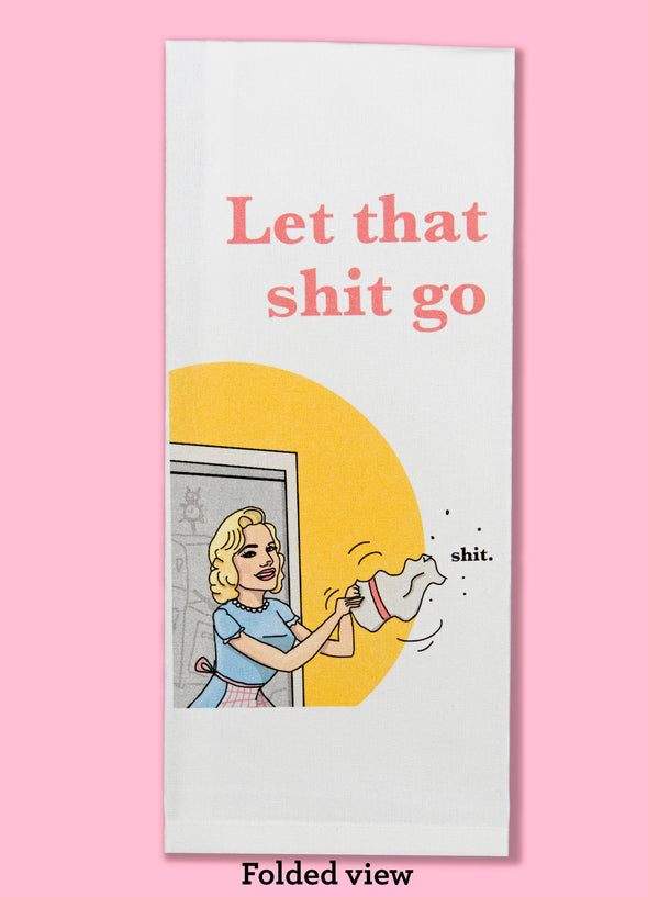 Folded dishtowel of a smiling woman shaking out a dishtowel with the phrase Let That Shit Go.