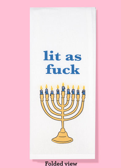 Folded dishtowel with illustration of a menorah and the phrase Lit as Fuck
