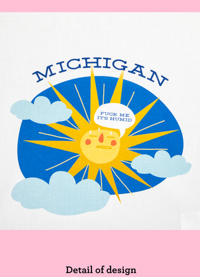 Detail of a dishtowel with a sweating sun peeking out behind three clouds and the phrase Michigan Fuck Me Its Humid.