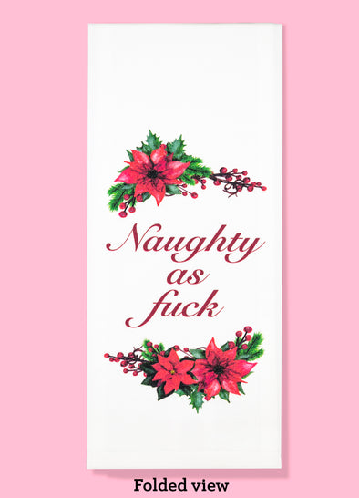 Folded dishtowel with poinsettia and cranberry illustrations and the phrase naughty as fuck