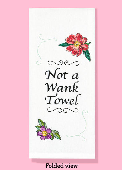Folded dishtowel with floral illustrations and the phrase not a wank towel