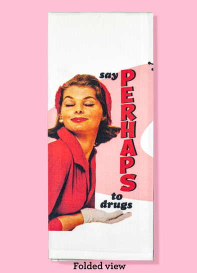 Folded dishtowel with the phrase say perhaps to drugs. The image on the towel is a vintage looking woman in a red dress looking content
