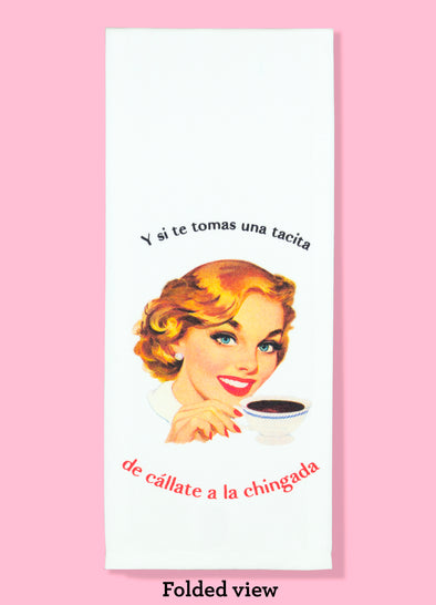 Folded dishtowel of a vintage looking illustration of a smiling woman with a cup of coffee and the phrase Y si te tomas una tacita de callate a la chingada.