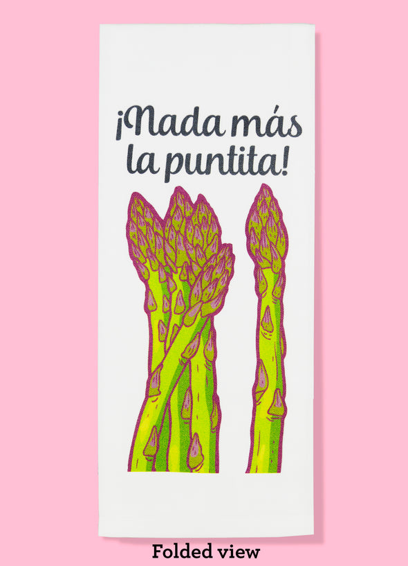 Folded dishtowel with an illustration of asparagus stalks and the phrase Nada mas la puntita