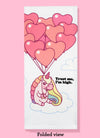 Folded dishtowel with the phrase trust me, I'm high. The illustration features a cartoon unicorn sitting on a cloud holding a bunch of heart-shaped balloons