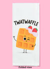 Folded dishtowel with the phrase twatwaffle. The illustration features a cartoon waffle winking and waving.
