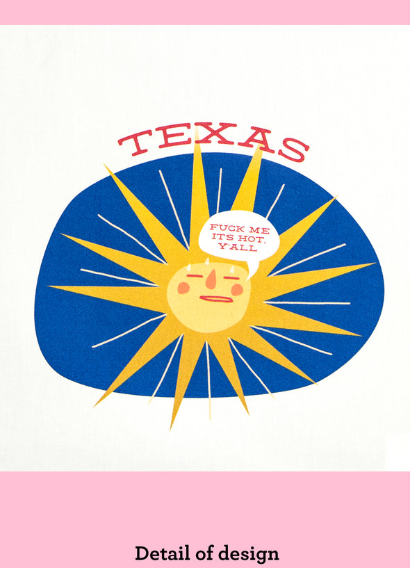 Close-up of a dishtowel with the phrase Texas fuck me it's hot, y'all and an illustration of a sweating sun.