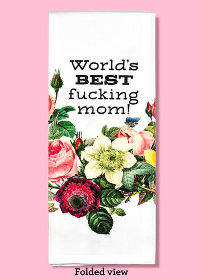 Folded dishtowel with the phrase World's best fucking mom! The text is surrounded by illustrations of various flowers and leaves, including roses.